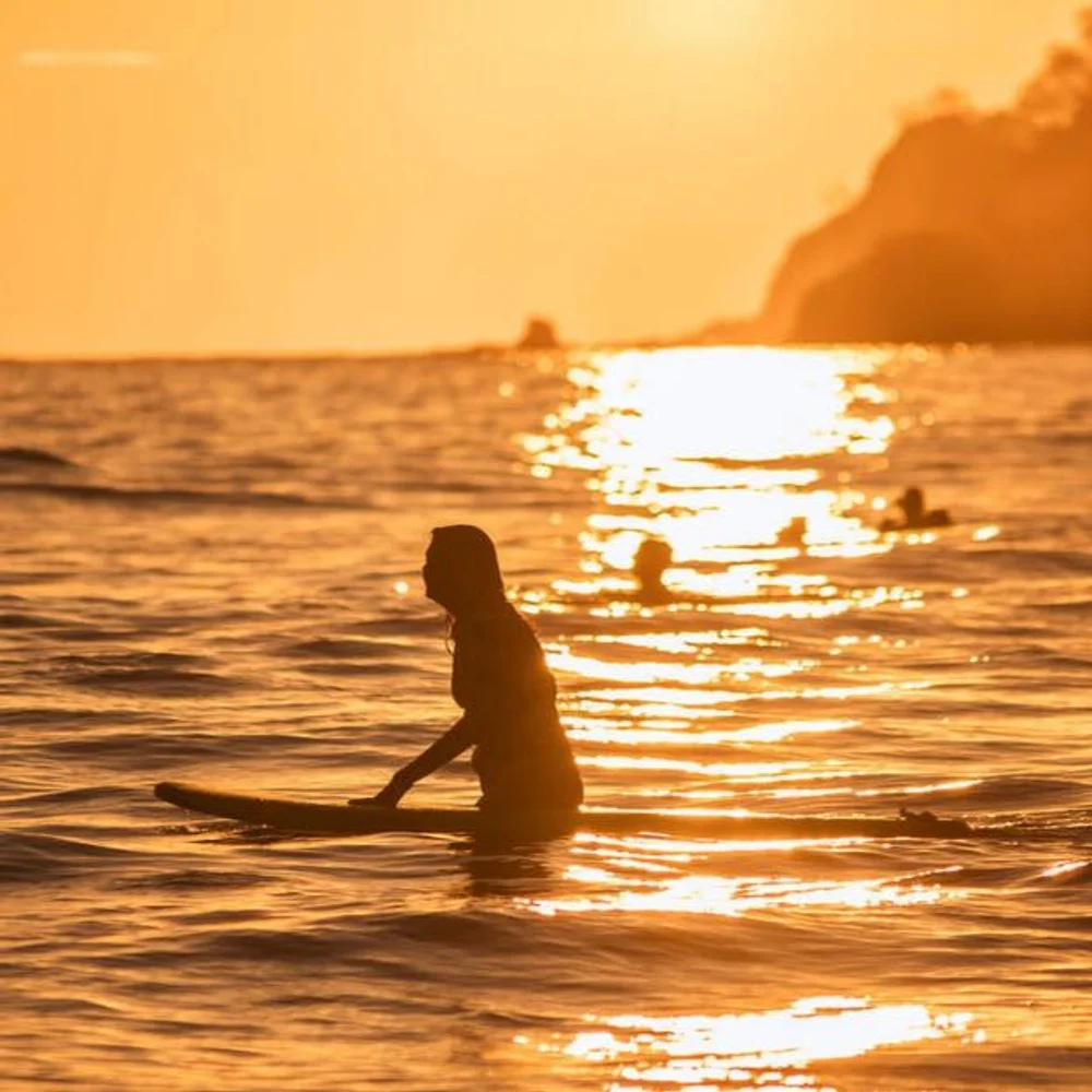 Surfer at sunset in Costa Rica