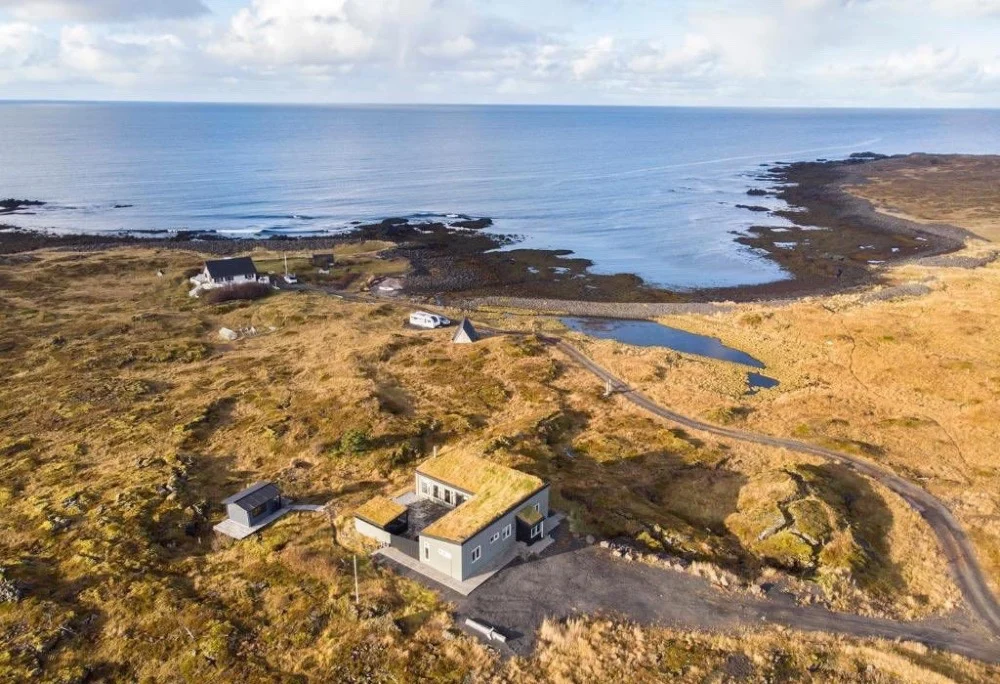 Aerial view of a seaside cabin in Iceland