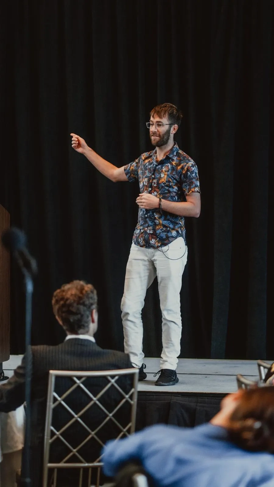Logan Elliott speaking on stage
