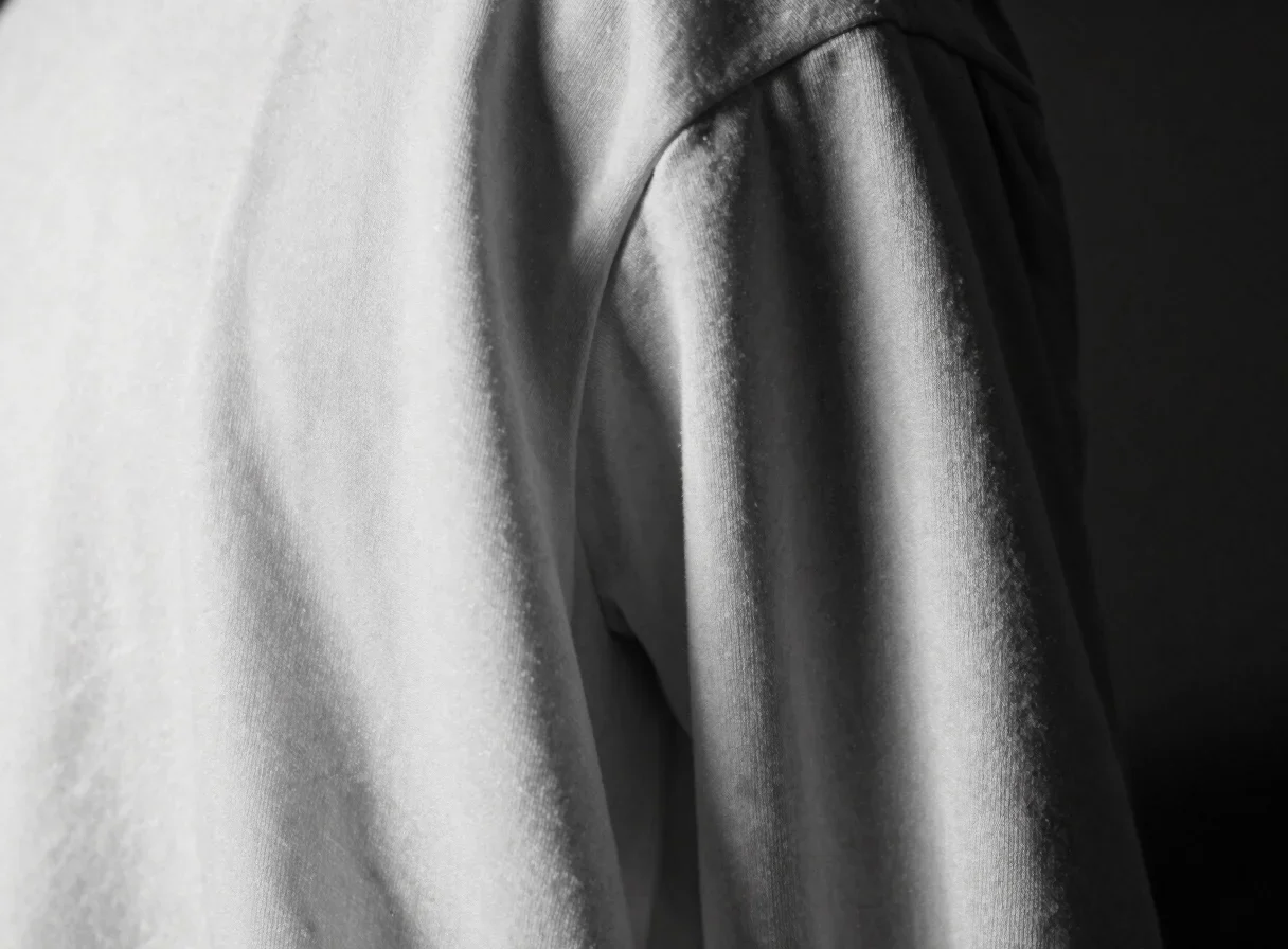 Monochrome close study of luminous draped silk