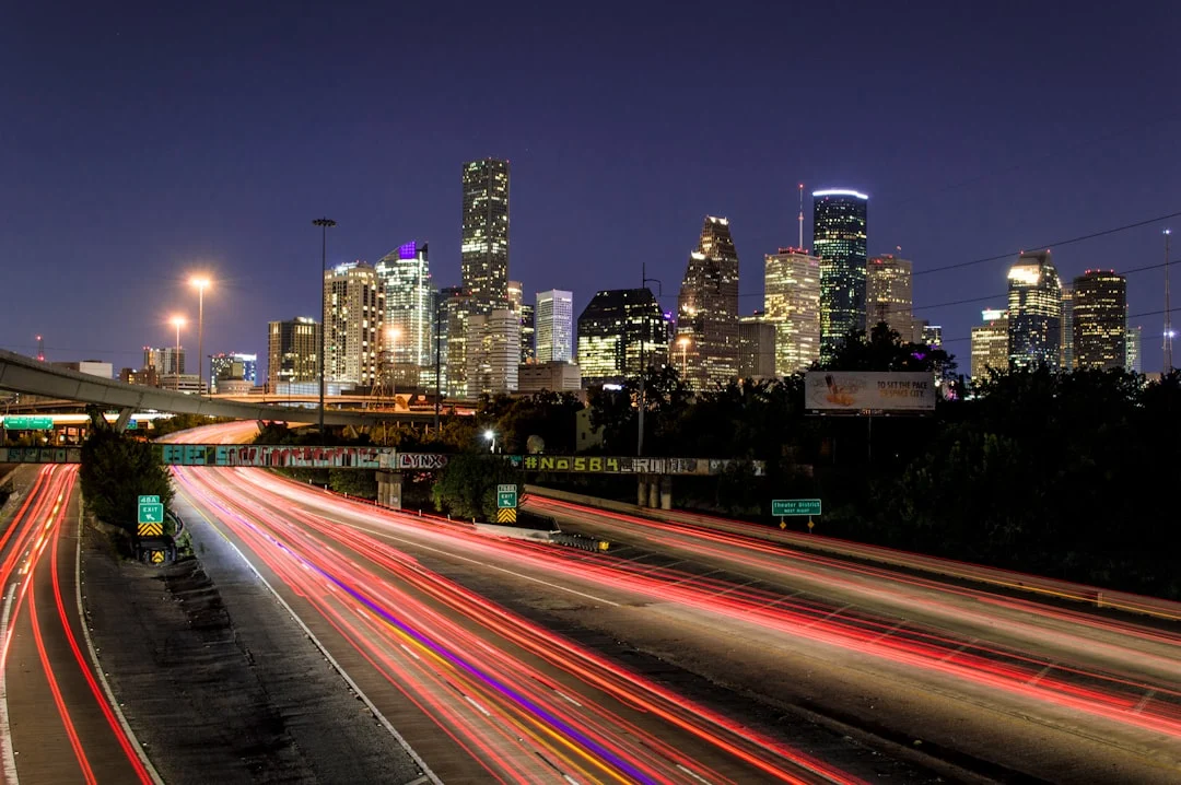 Houston skyline and highway light trails at night