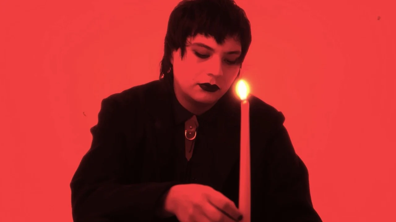 Red candlelit still from All We Are (Are Memories) music video