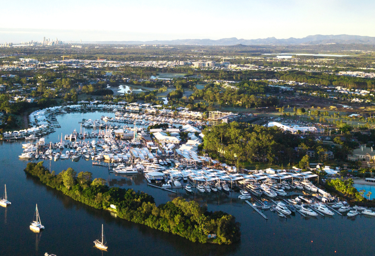 Aerial view of the Sanctuary Cove marina filled with boats and show displays