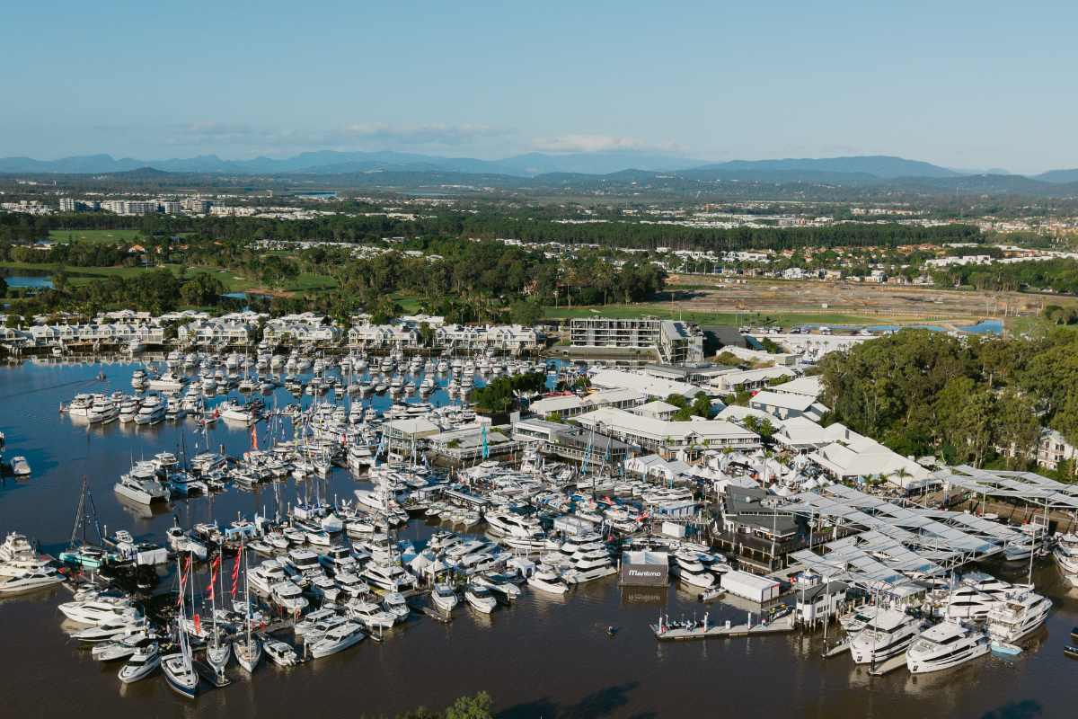 Aerial view of the Sanctuary Cove marina filled with boats and show displays