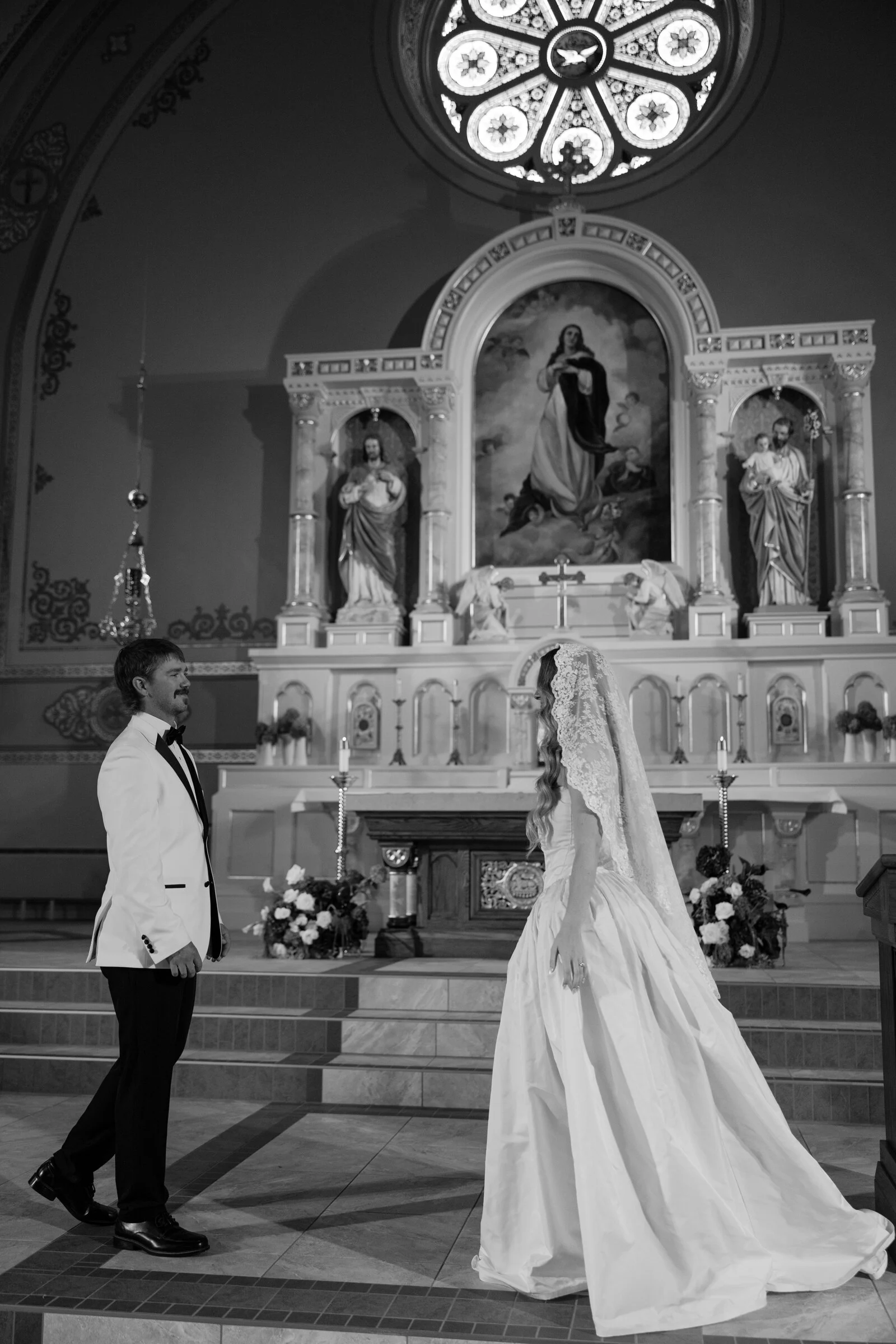 Black-and-white photograph of a couple inside a church