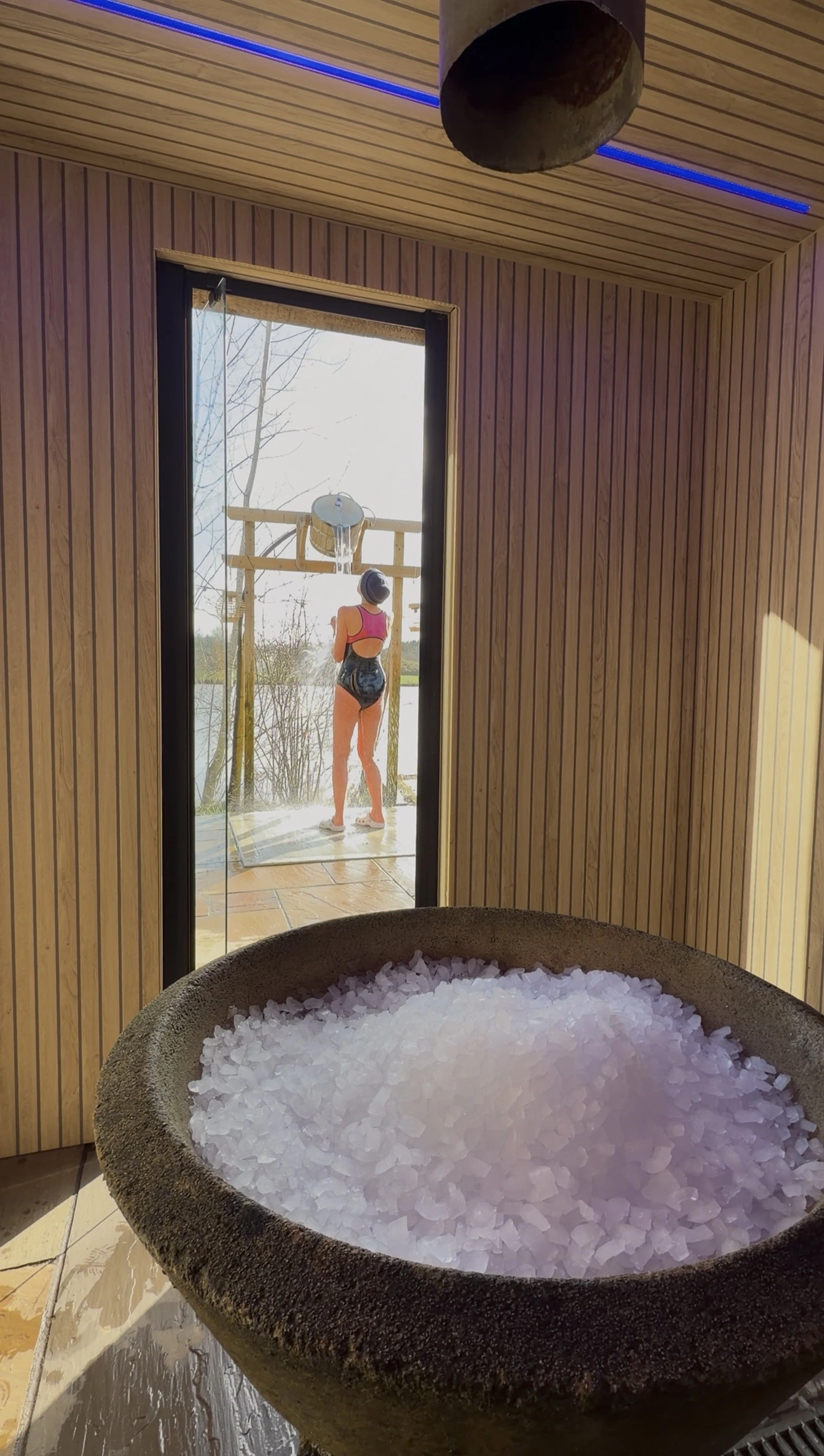 Ice-filled bowl inside the Ice Cabin with the lake beyond