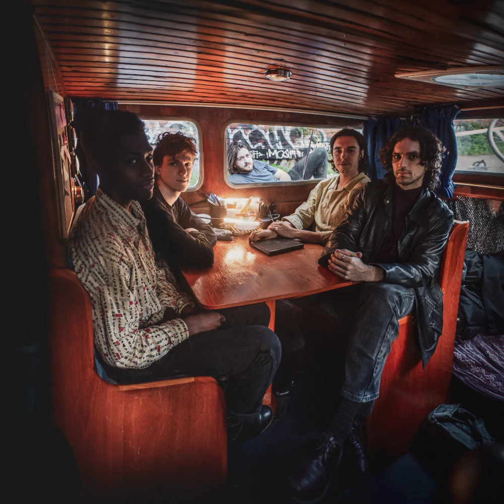 FEZ gathered beside a canal boat in a wide editorial group photograph