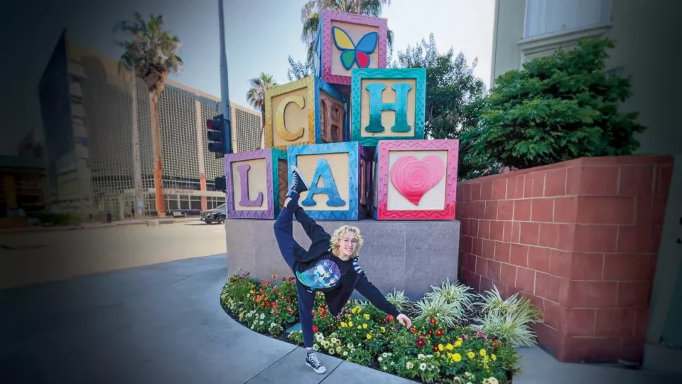 Marta Miller strikes a figure-skating pose in front of the Children’s Hospital Los Angeles blocks
