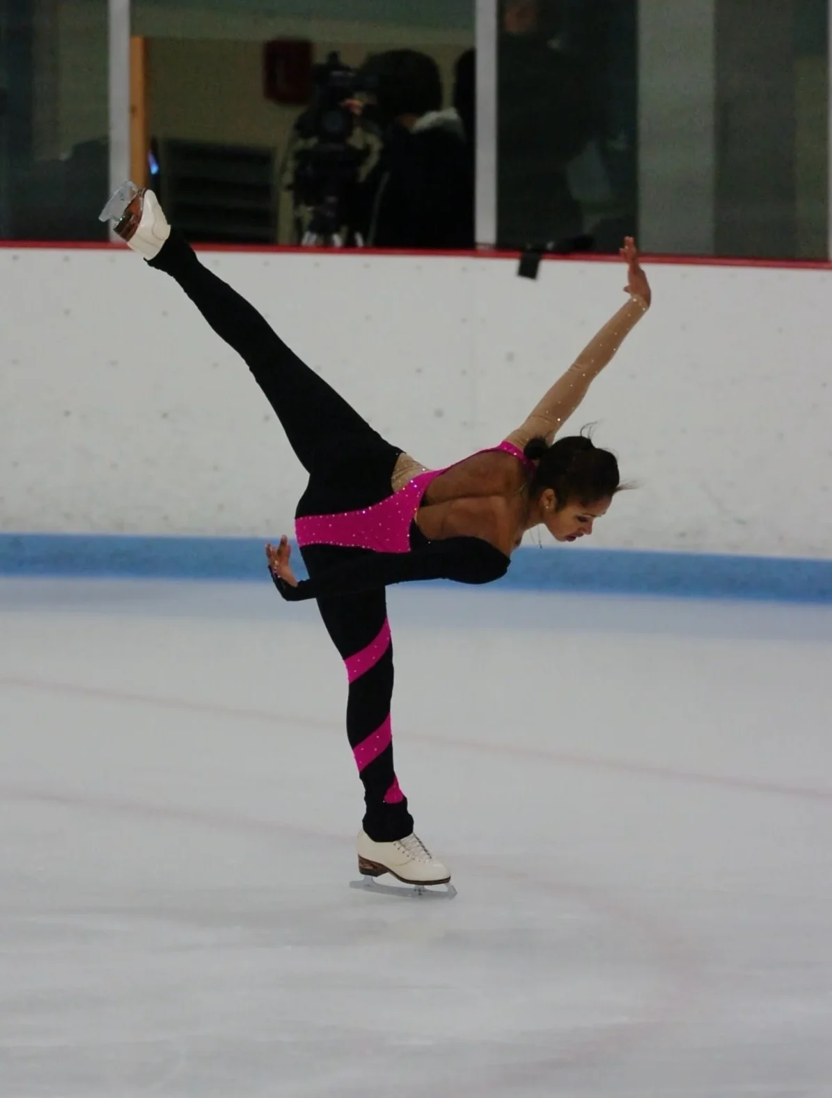 Coach Tashe performing a spiral on the ice