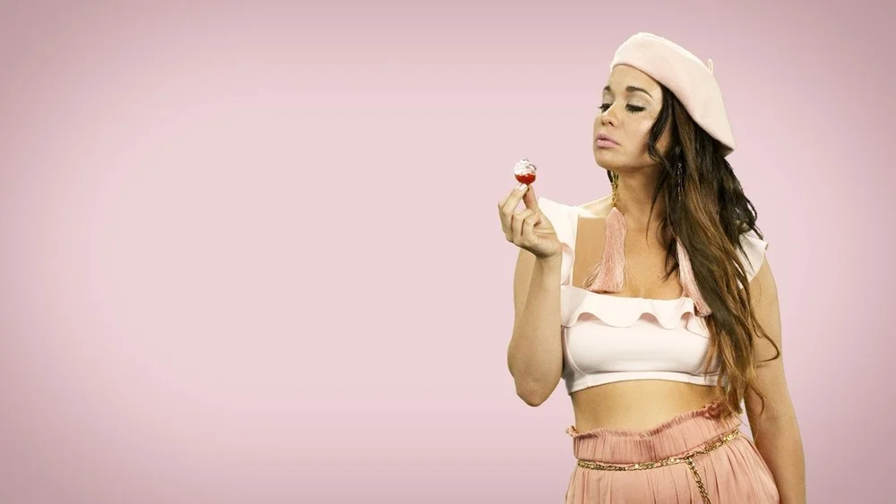 Oriel in pink in the Whipped Cream music video