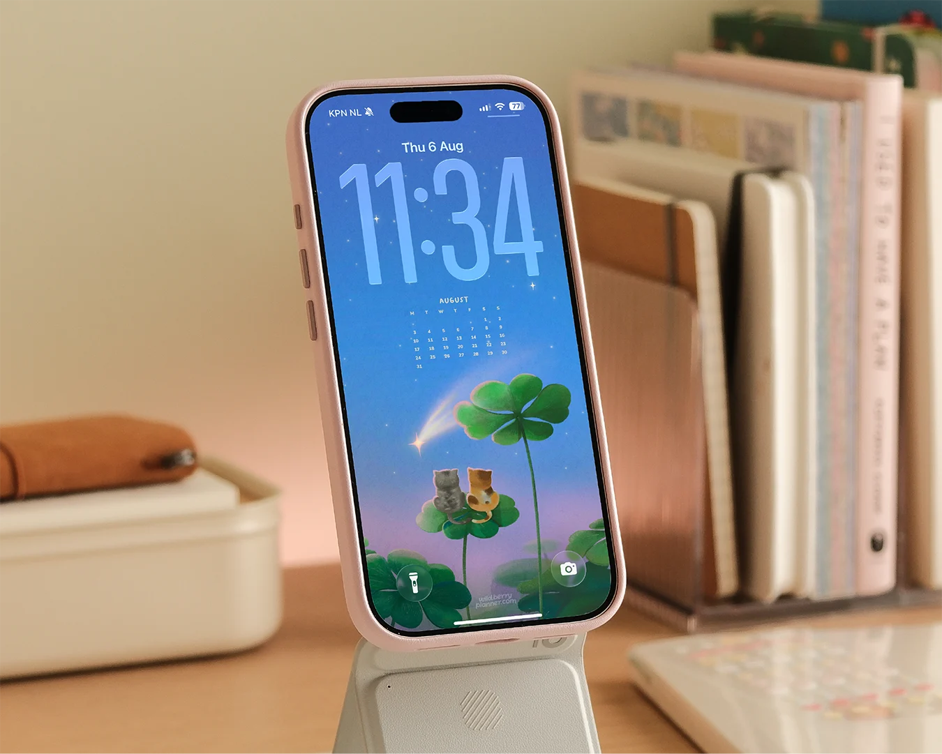 A wallpaper shown on a phone with an illustration and calendar