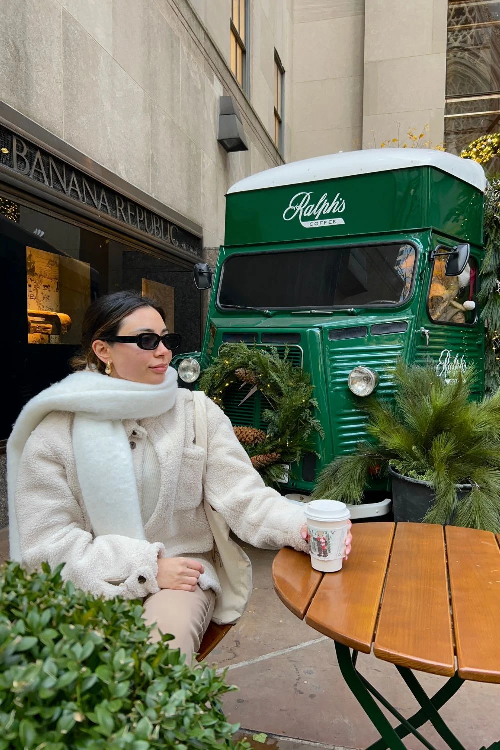 Arabella beside the green Ralph’s Coffee truck in New York City