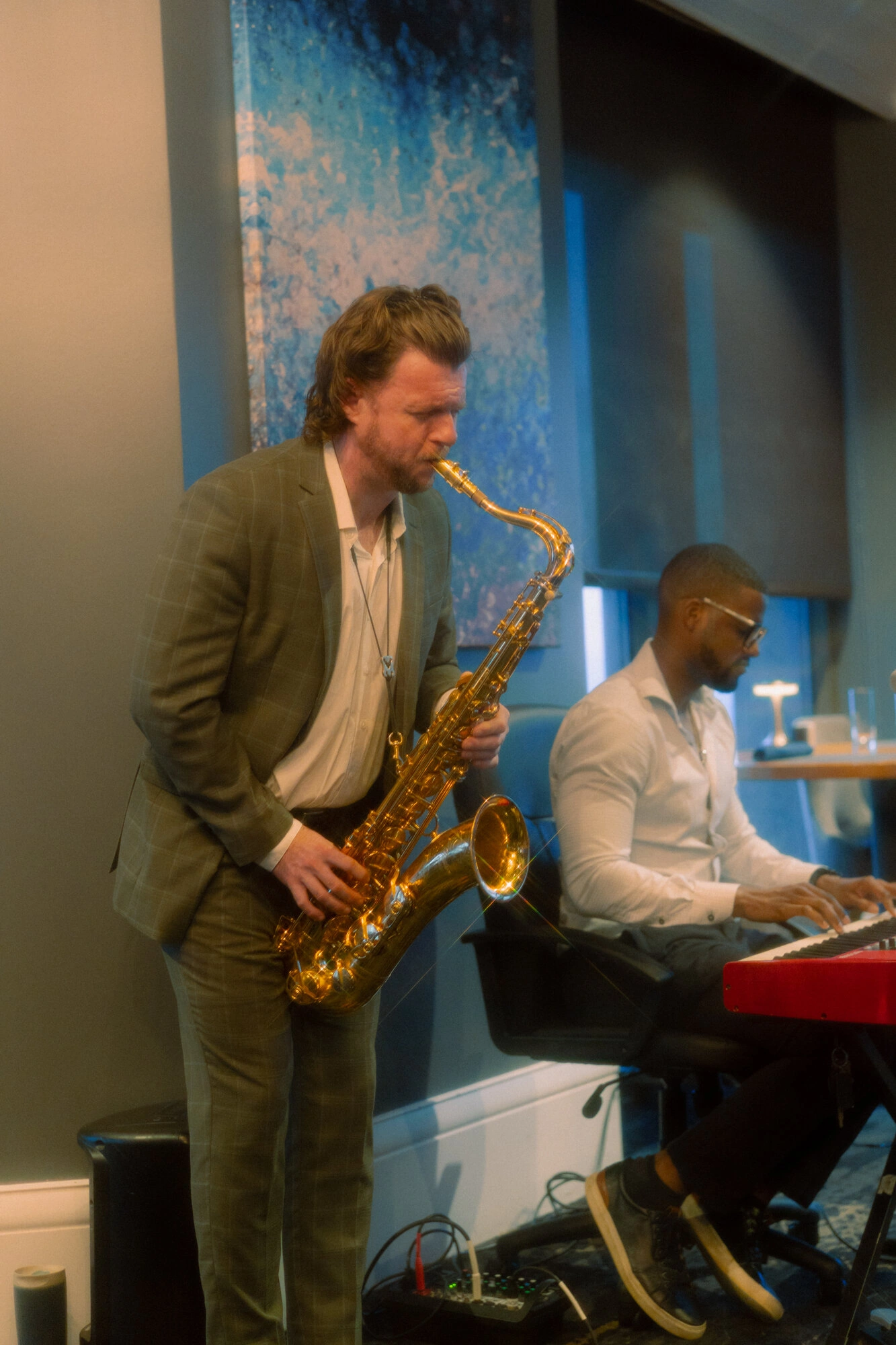 Saxophonist and Chops on keys at an intimate gig