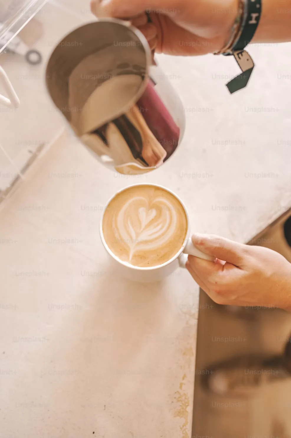 Coffee being poured behind the café bar
