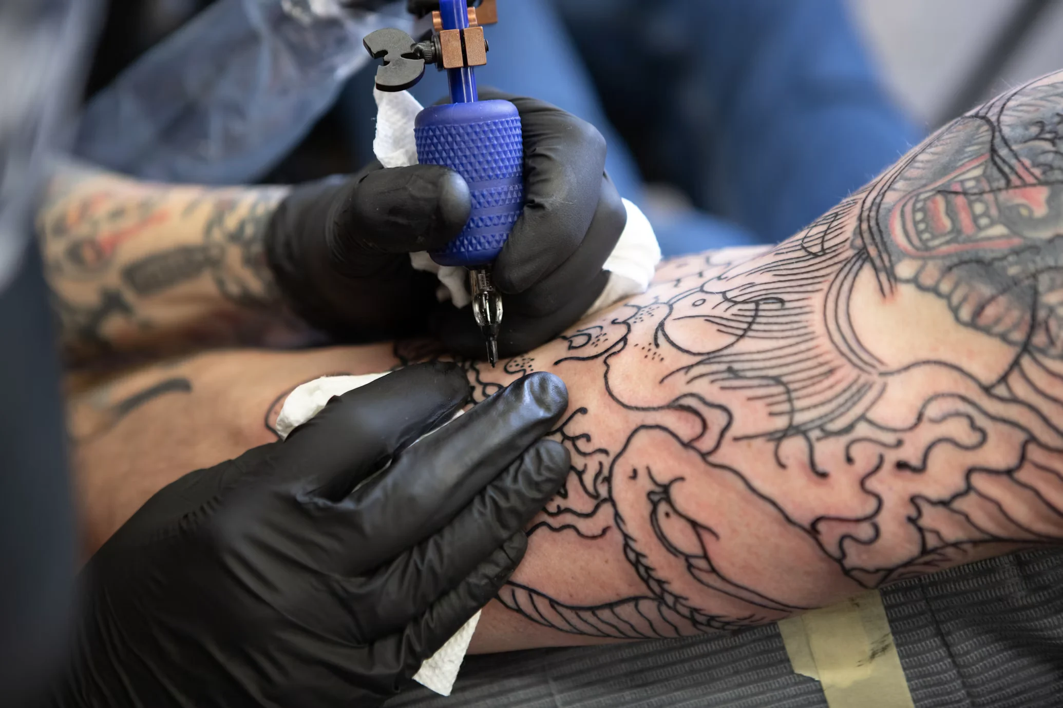 Blackwork animal tattoo on a calf
