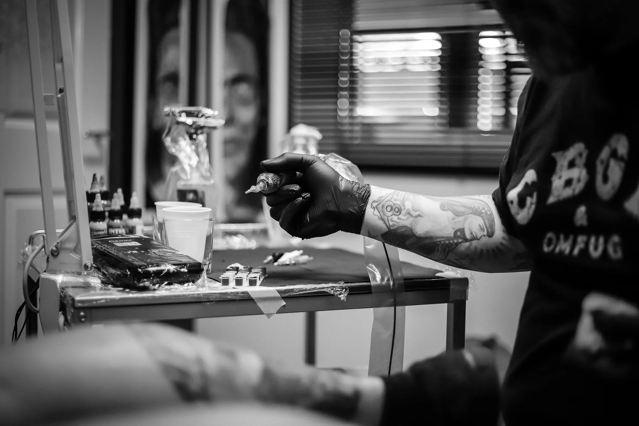 Large botanical blackwork tattoo on an upper arm