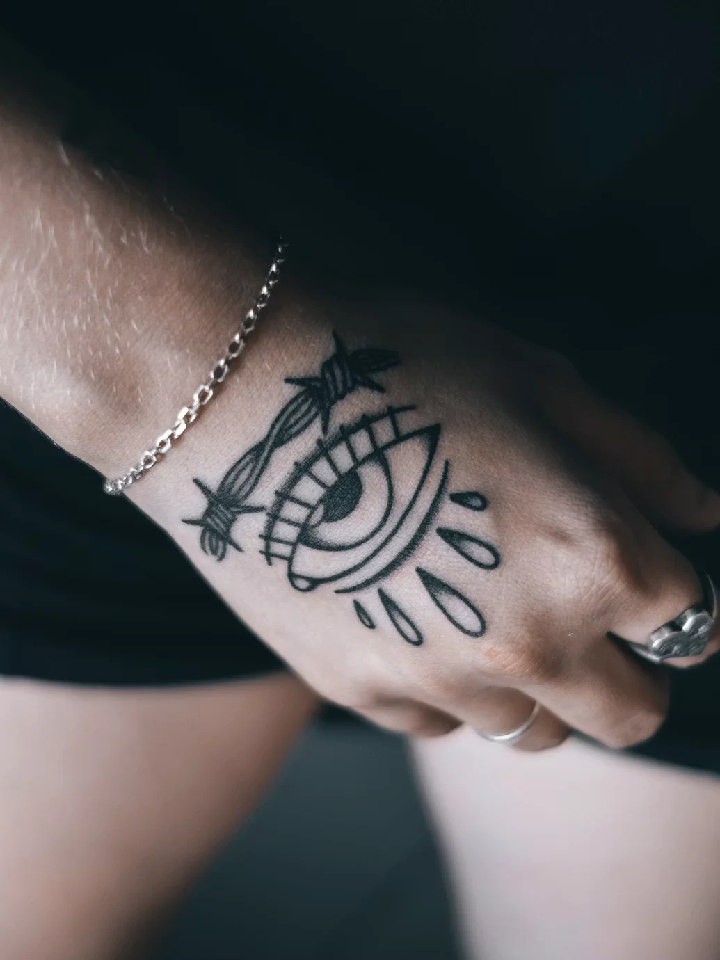Fine-line architectural tattoo across a shoulder