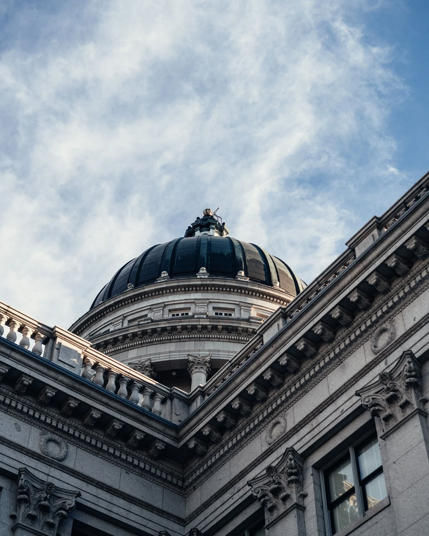 Architectural photograph of a domed Salt Lake City building beneath a blue sky