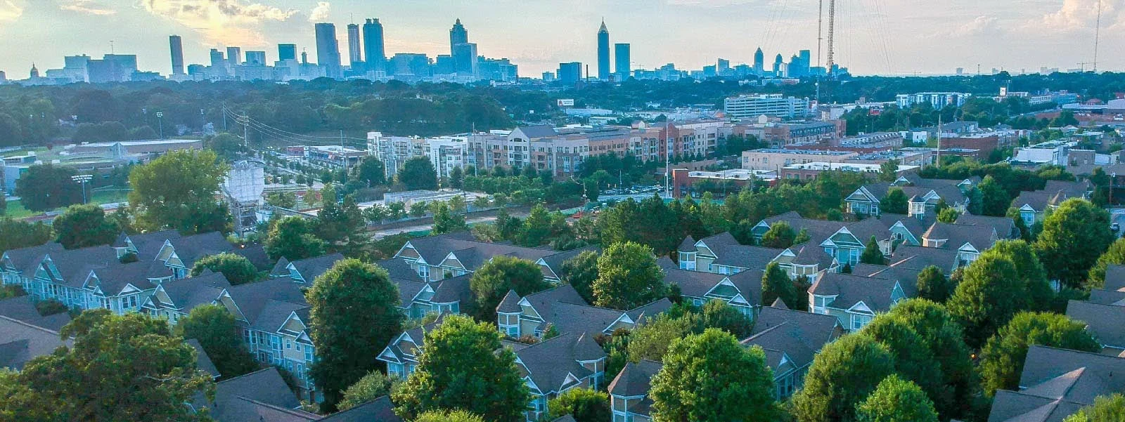Metro Atlanta neighborhoods with the city skyline in the distance