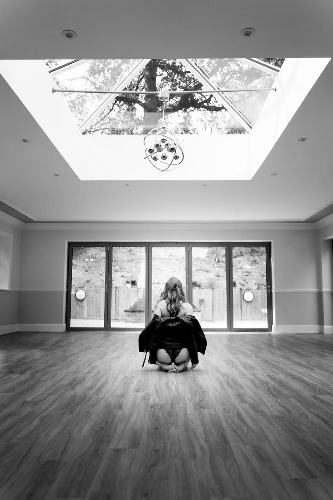 Black-and-white portrait in an expansive interior