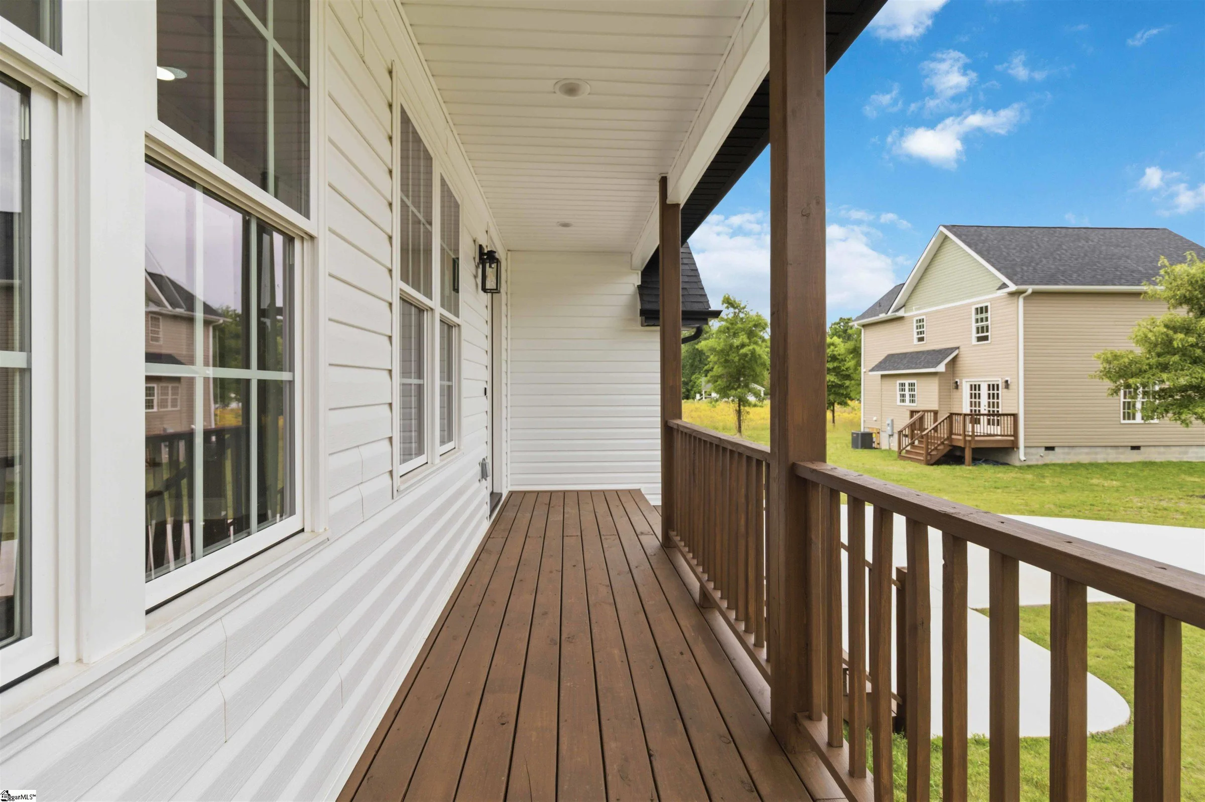Wide covered porch on a new farmhouse