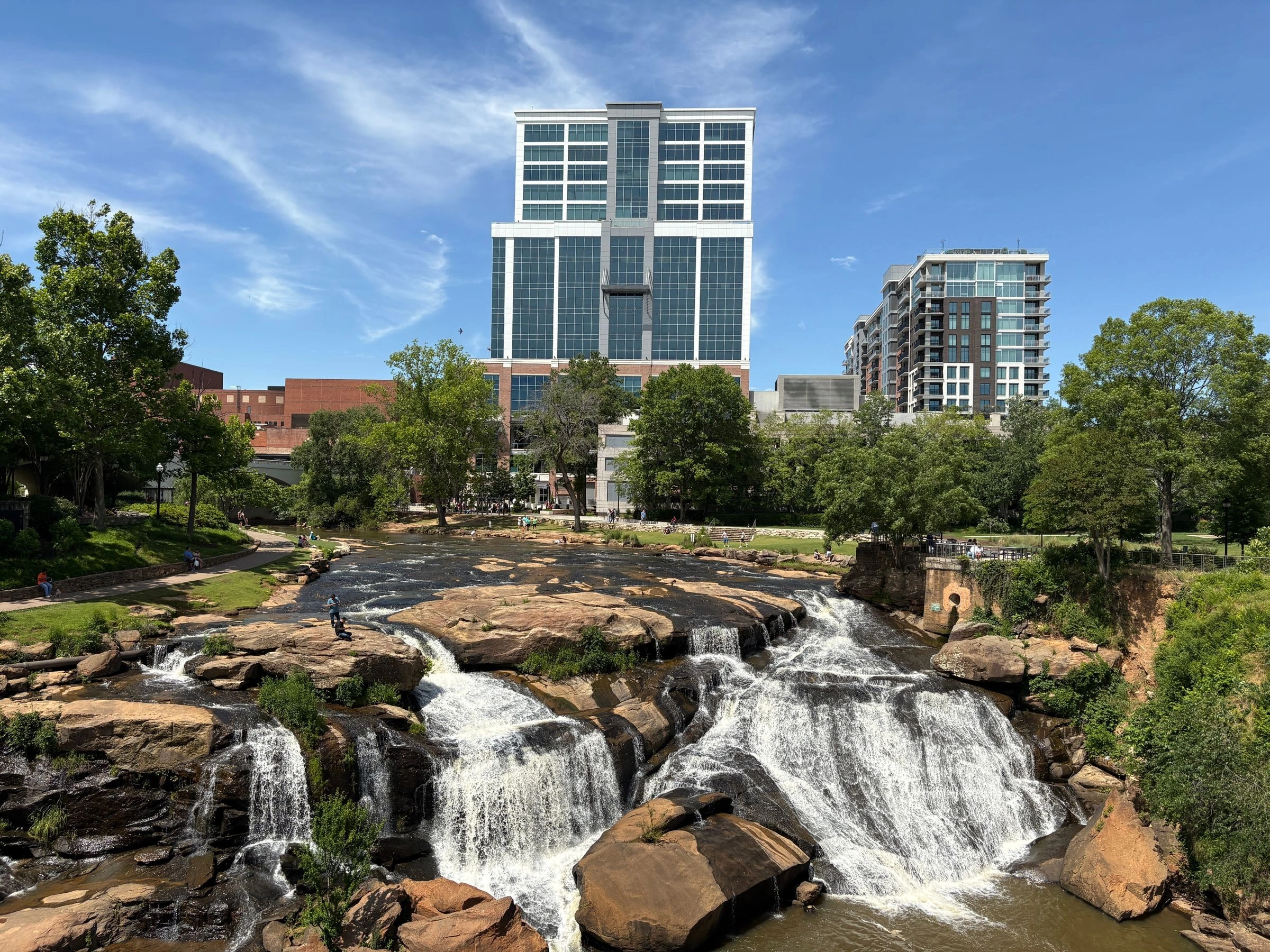 Reedy River Falls in Falls Park with downtown Greenville behind