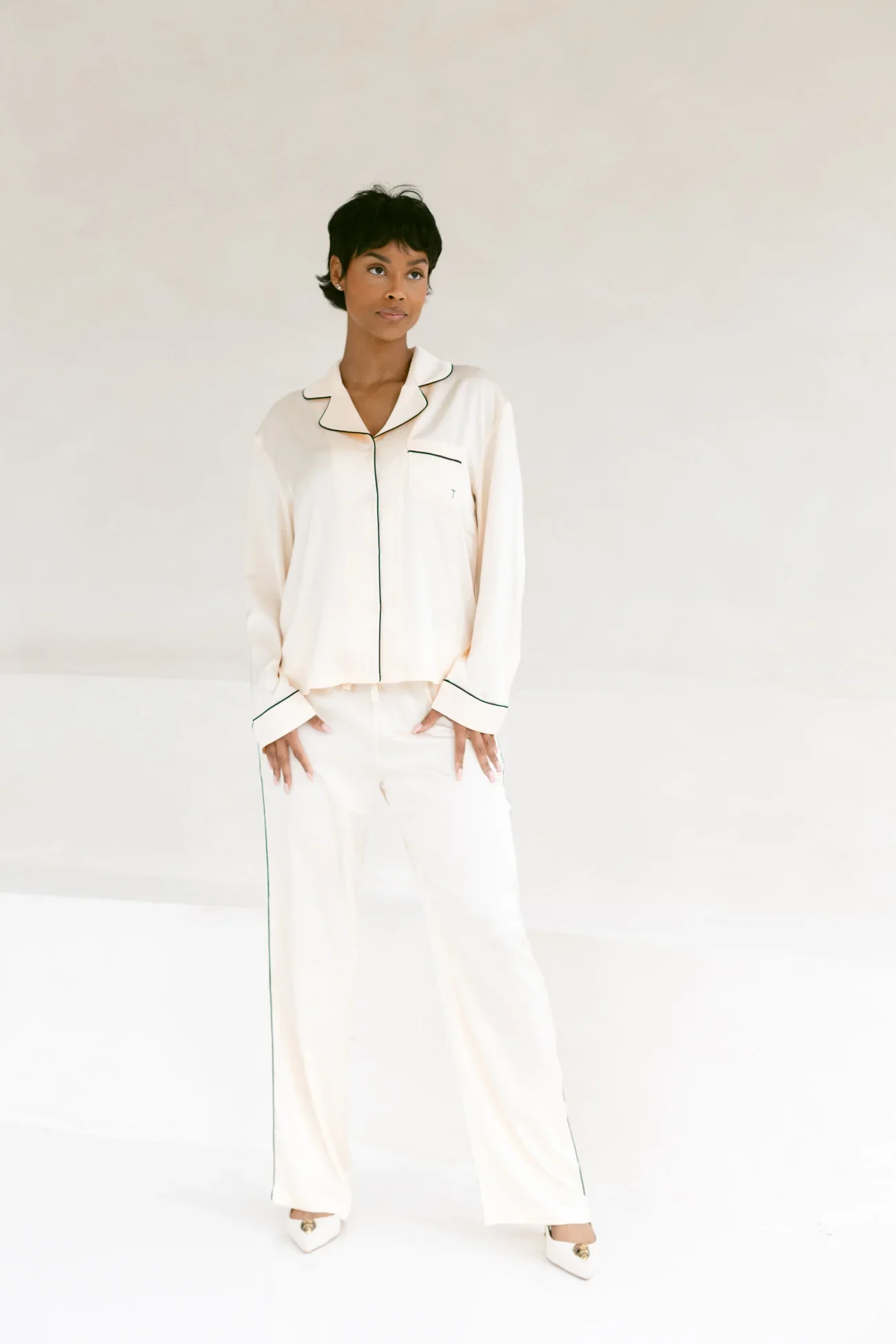 Model wearing the champagne TOREY satin pajama set