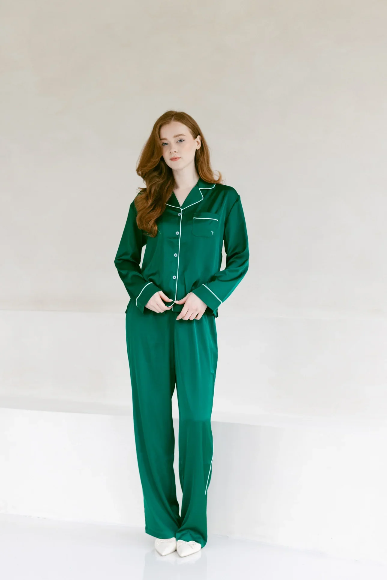 Model wearing the emerald TOREY satin pajama set