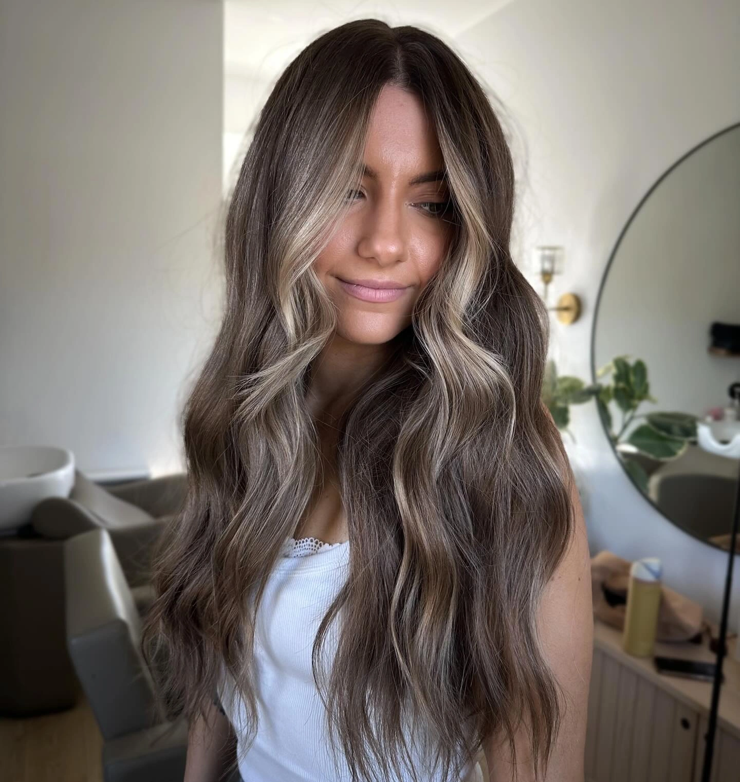 Dark brunette waves with soft blonde face-framing pieces