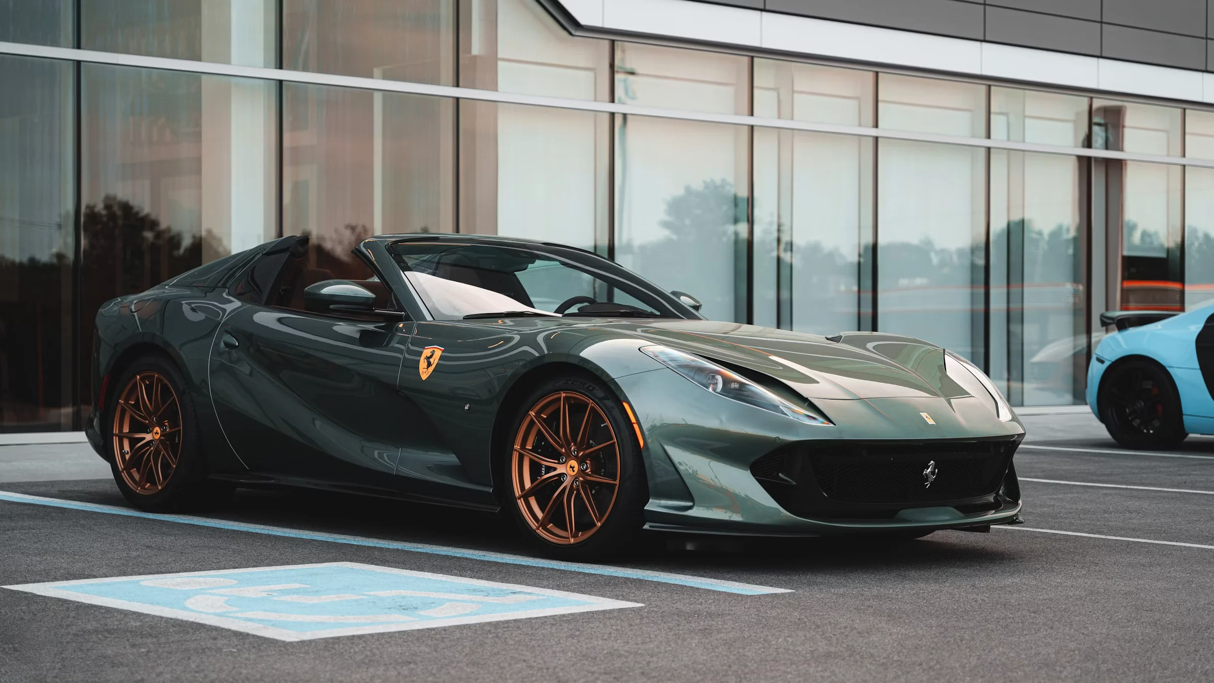 Rosso Fuoco Ferrari 812 GTS in the Nocturne showroom