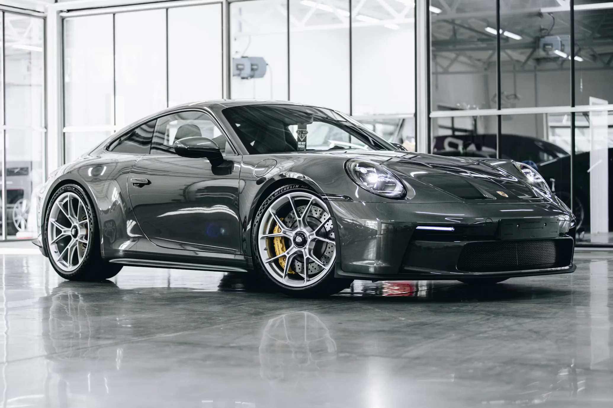 Black Porsche 911 GT3 Touring photographed outdoors