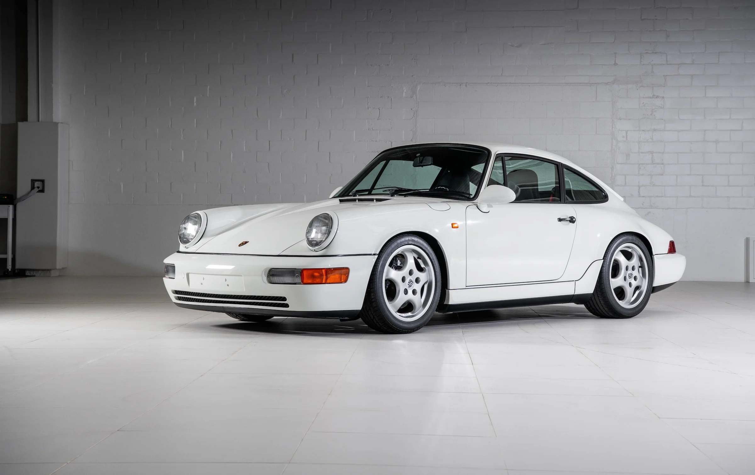 Slate grey Porsche 911 Carrera RS 3.8 in a studio