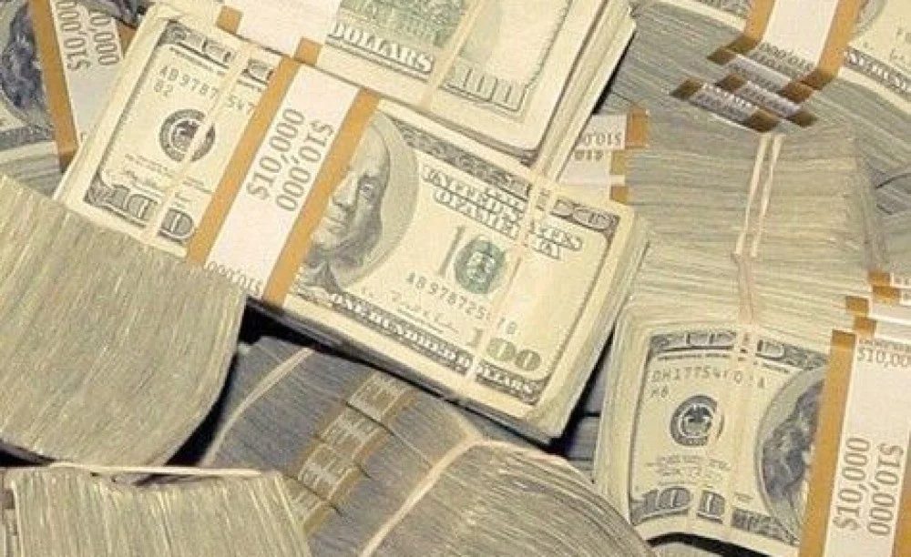 Stacks of money representing paid creator work