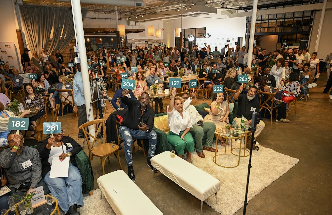 A full room of guests at a FreeRent fundraiser