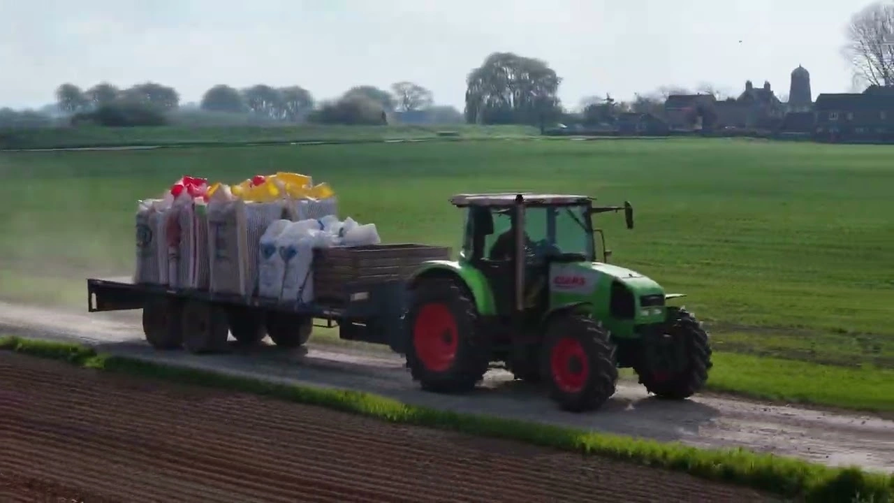 Tractor carting seed potatoes at Coggon Bros