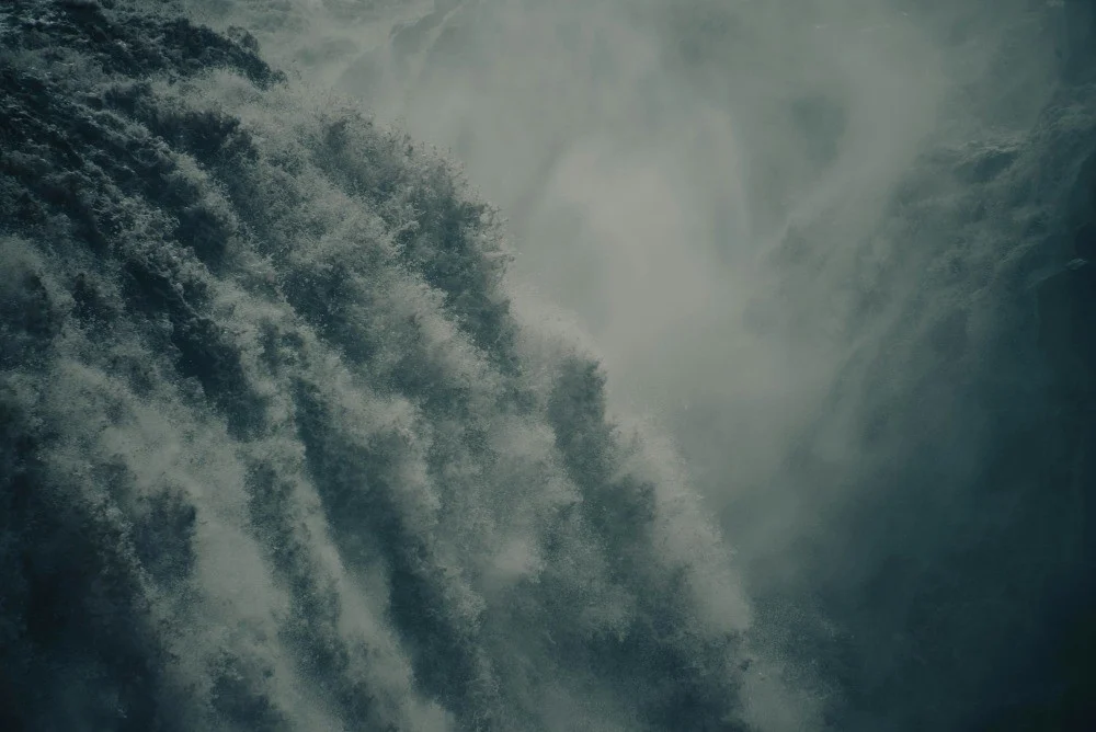 Aerial view of a winding river across the Icelandic landscape