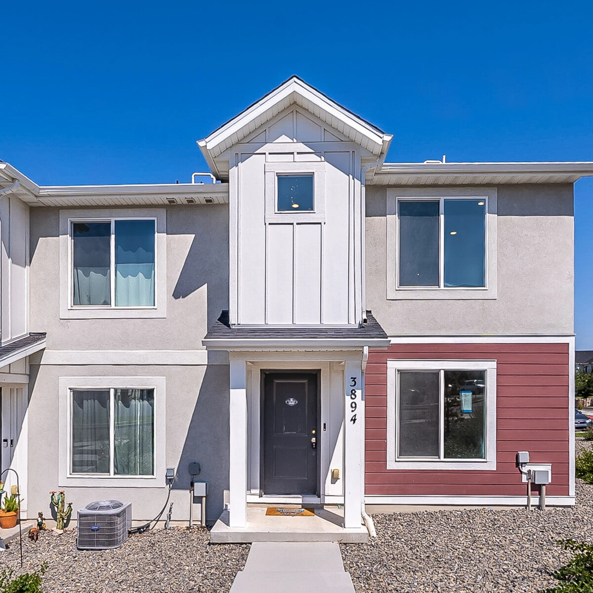End-unit townhome with a red accent wall at 3894 S Buckland Dr, Magna