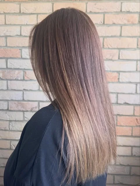 Long brunette hair with a glossy, softly blended root colour and toner refresh