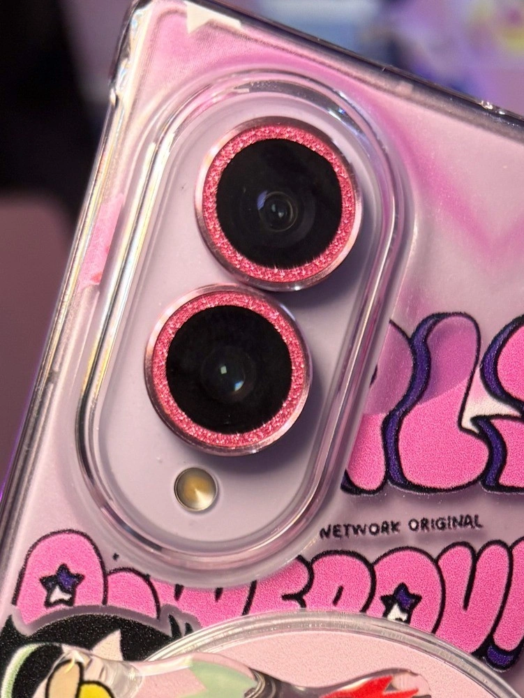 Close-up of pink glitter lens protectors on the Z Fold 8 cameras