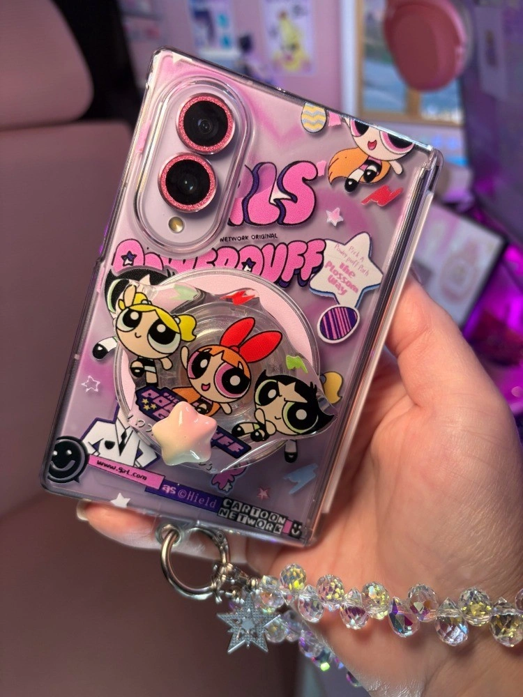 Galaxy Z Fold 8 in a clear Powerpuff Girls case with a crystal wrist charm