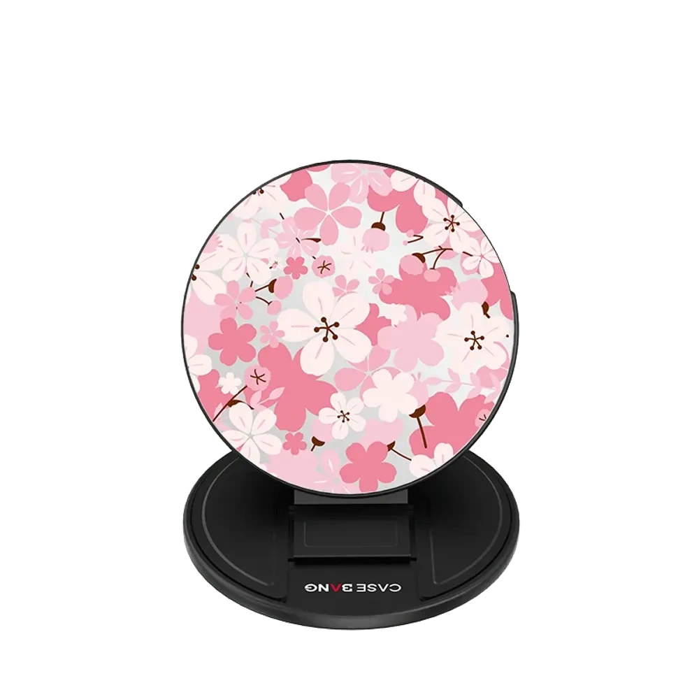 Round MagSafe grip stand with a pink sakura tree print