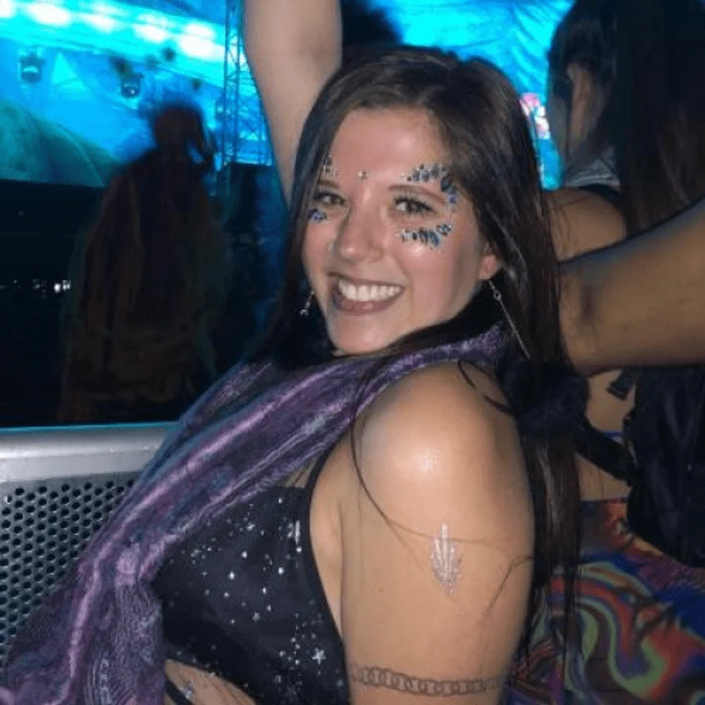 Kennedy Cymerman smiling at an electronic music event