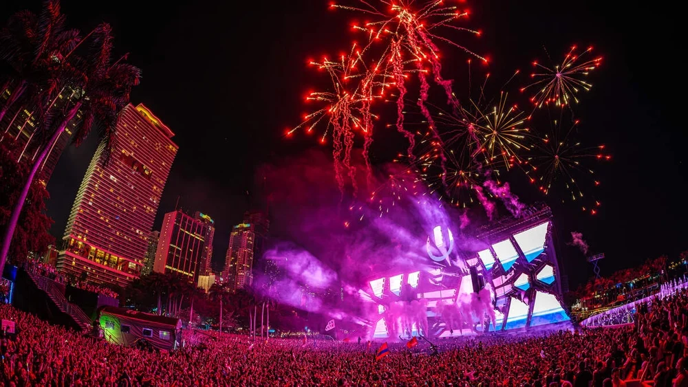 Ultra Music Festival stage and crowd beneath fireworks