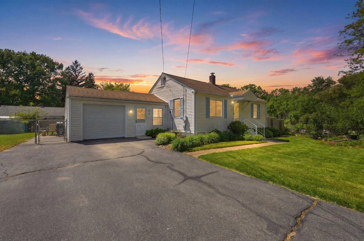 Single-family home at 44 Harding St in Springfield, MA at sunset