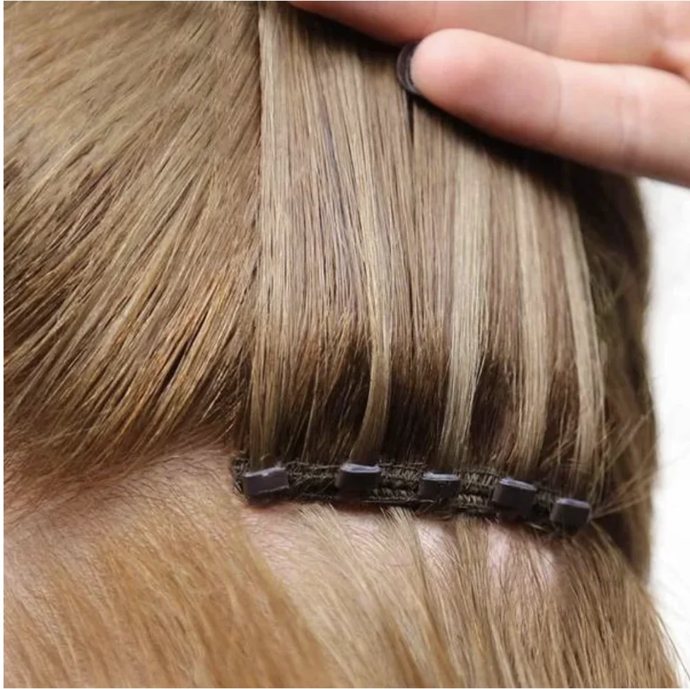Close view of hair extension application at Acute Salon