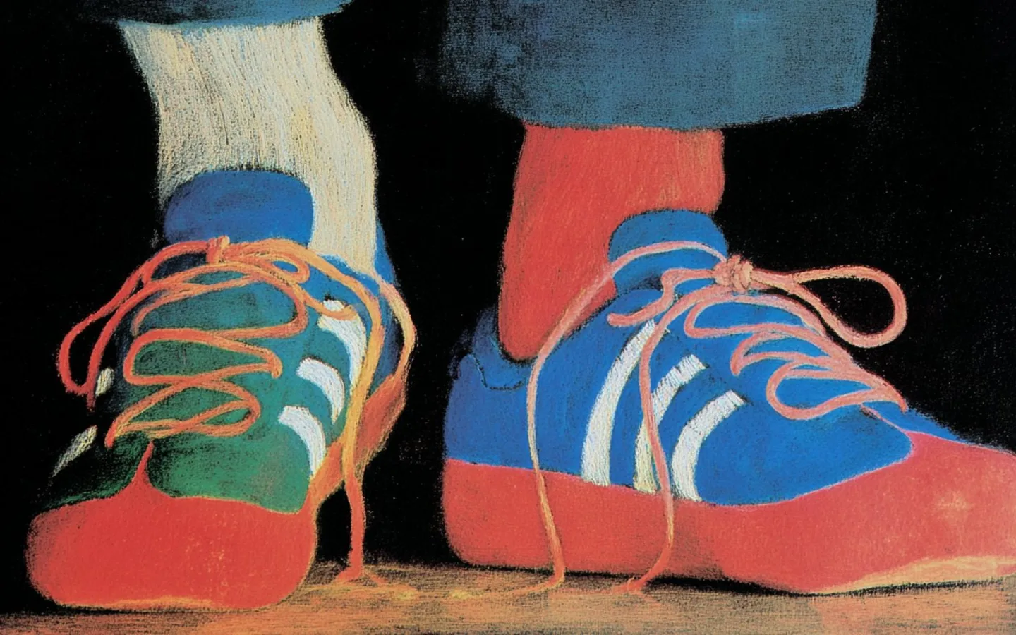 A pair of bright red and blue sneakers viewed from above